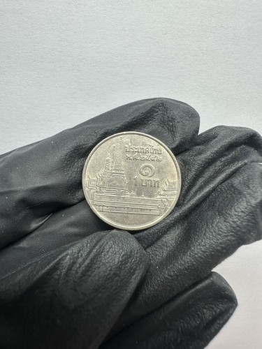 Thailand one baht coin - one,